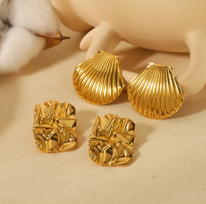 Maelis | Gouden oorbellen in schelpvorm met glans